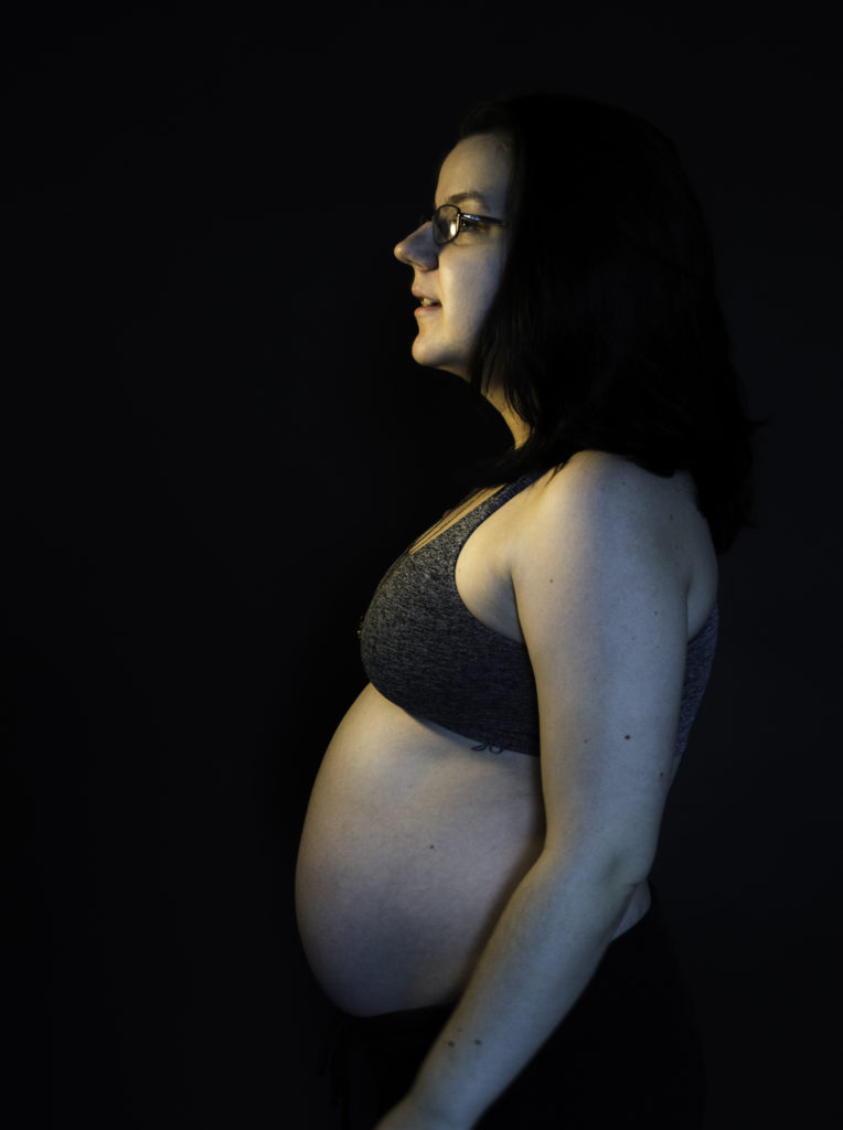 studio portrait of pregnant woman